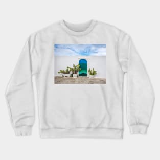 Blue door with cactus and white wall Crewneck Sweatshirt